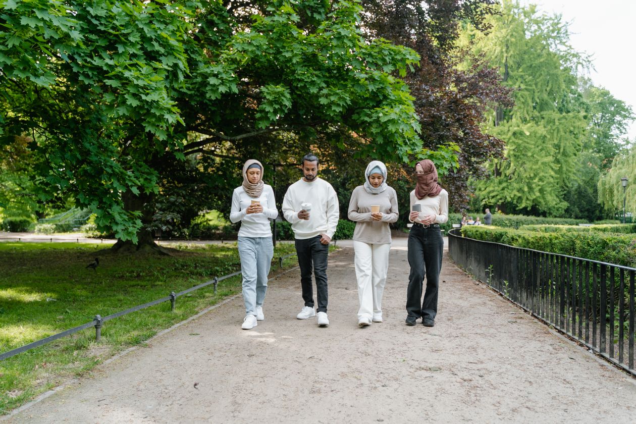 Friends spending time together on a walk in a park